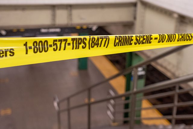 crime tape in a subway station